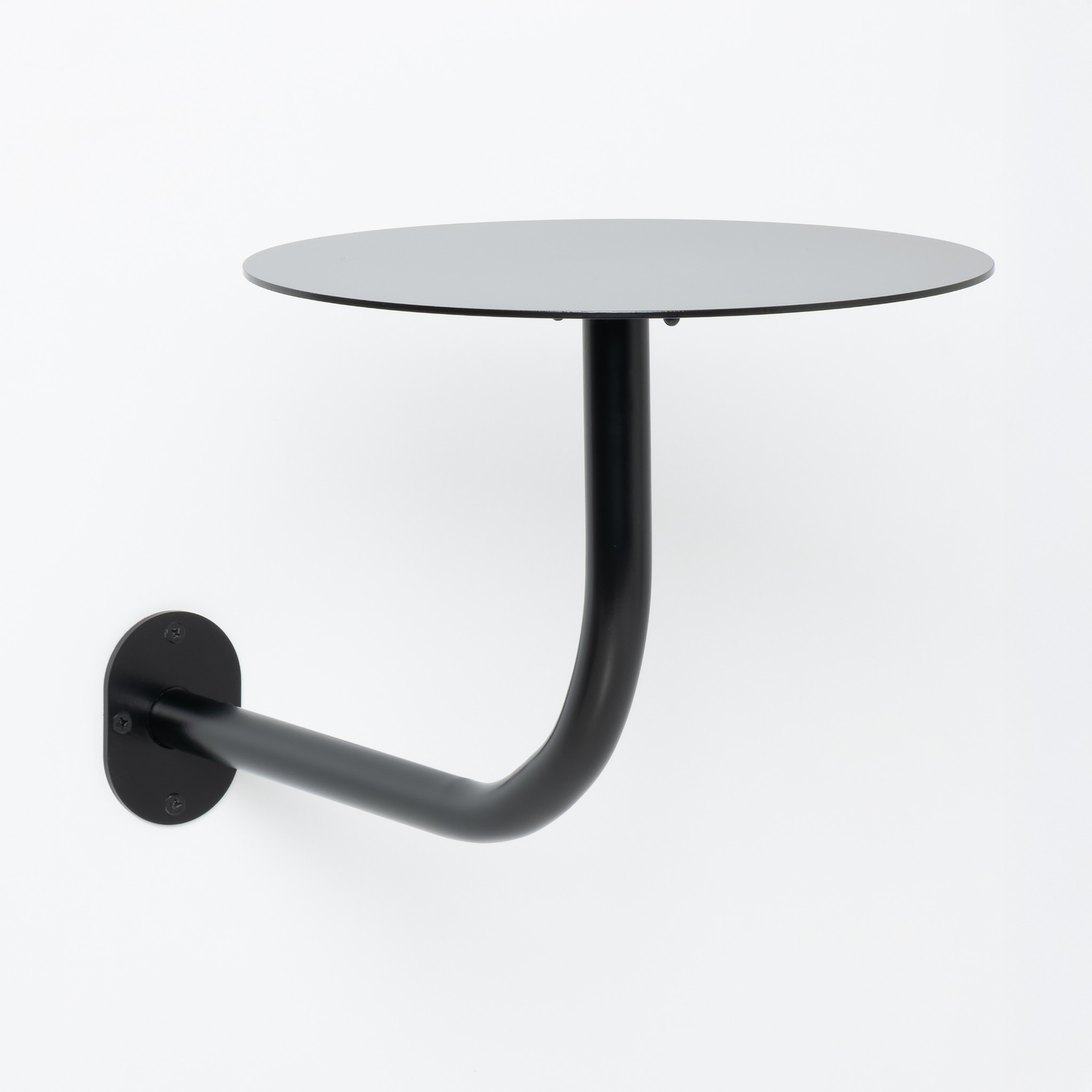 Siyah metal duvar masası, montaj aşaması ve vida detaylarıyla.

